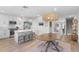 Open kitchen featuring an island with bar stool seating and a view of the dining area at 5351 Bridge St # 41, Tampa, FL 33611