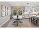 Open concept kitchen and dining area, featuring modern appliances and a stylish light fixture at 5351 Bridge St # 41, Tampa, FL 33611