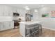 Bright kitchen featuring an island with seating and modern stainless steel appliances at 5351 Bridge St # 41, Tampa, FL 33611