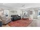 Comfortable living room featuring a ceiling fan, a colorful rug, and plenty of natural light at 5351 Bridge St # 41, Tampa, FL 33611
