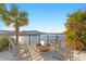 Cozy waterfront patio with a fire pit and comfortable seating, offering scenic views of the water at 5351 Bridge St # 41, Tampa, FL 33611