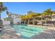 Inviting community pool with cabanas, comfortable seating, and clear blue water reflecting a sunny sky at 5351 Bridge St # 41, Tampa, FL 33611
