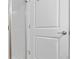 Close up of a white door into shower featuring white subway tile at 5351 Bridge St # 41, Tampa, FL 33611