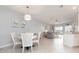 Dining area featuring a round table and chairs, open to the living room and kitchen at 5514 Tidal Breeze Cv, Bradenton, FL 34211