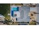 Aerial view featuring a house with a pool, dock, boat and well maintained roof at 629 59Th Ave, St Pete Beach, FL 33706