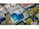 Aerial view of home with pool and dock access to a scenic waterway at 629 59Th Ave, St Pete Beach, FL 33706