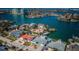 Waterfront home with direct water access, lush landscaping, and situated in a coastal community with a stunning bay view at 629 59Th Ave, St Pete Beach, FL 33706