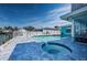 Waterfront backyard with a pool and a hot tub at 629 59Th Ave, St Pete Beach, FL 33706