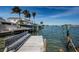 Private dock with boat lift and seating area provides direct access to the bay at 629 59Th Ave, St Pete Beach, FL 33706