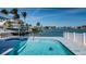 Beautiful swimming pool with waterfront views in backyard at 629 59Th Ave, St Pete Beach, FL 33706