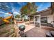Backyard featuring a screened in porch, grill, hot tub and playset at 6445 109Th N Ave, Pinellas Park, FL 33782