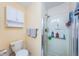 This bathroom features a glass shower and a toilet, offering modern convenience and functionality at 6445 109Th N Ave, Pinellas Park, FL 33782