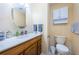 This charming bathroom offers a single vanity, ample lighting, and a toilet for your everyday convenience at 6445 109Th N Ave, Pinellas Park, FL 33782
