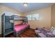 This bedroom includes a bunkbed and toy seating, perfect for a growing Gathering at 6445 109Th N Ave, Pinellas Park, FL 33782
