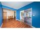 Dining room with hardwood floors and sliding glass doors to the screened-in porch at 6445 109Th N Ave, Pinellas Park, FL 33782