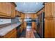 Updated kitchen featuring stainless steel appliances, ample wooden cabinetry, and tile backsplash, combining style and convenience at 6445 109Th N Ave, Pinellas Park, FL 33782