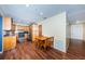 Well-equipped kitchen with modern appliances, wooden cabinetry, and wood floors, blending style and functionality for cooking enjoyment at 6445 109Th N Ave, Pinellas Park, FL 33782