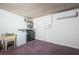 Spacious laundry room with washer, dryer, utility sink, and mini-split air conditioner at 6445 109Th N Ave, Pinellas Park, FL 33782