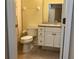 Bathroom with toilet, vanity, and shower/tub combination at 6815 Dali Ave # F101, Land O Lakes, FL 34637