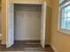 Bedroom walk-in closet with ample storage shelves and natural light from the window making organization simple at 6815 Dali Ave # F101, Land O Lakes, FL 34637