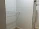 A simple closet with wire shelving is brightly lit and ready for storage at 6815 Dali Ave # F101, Land O Lakes, FL 34637