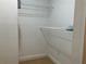 This walk-in closet features wire shelving, a neutral paint color, and carpeting at 6815 Dali Ave # F101, Land O Lakes, FL 34637