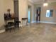 Open-concept living area with neutral walls and floors, featuring stylish decor and ample space at 6815 Dali Ave # F101, Land O Lakes, FL 34637
