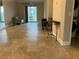 Spacious living room with tile floors, neutral walls, and sliding glass doors to patio at 6815 Dali Ave # F101, Land O Lakes, FL 34637