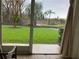 Relaxing patio with a serene view of the lush, green lawn and tropical landscaping, perfect for outdoor enjoyment at 6815 Dali Ave # F101, Land O Lakes, FL 34637
