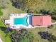 Birds-eye-view of community pool and surrounding green space and trees at 7200 Ulmerton Rd # B4, Largo, FL 33771