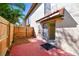 Cozy backyard patio with a privacy fence and sliding glass door for easy indoor-outdoor flow at 7200 Ulmerton Rd # B4, Largo, FL 33771