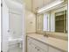 Well-lit bathroom with a vanity, mirror, and a tub-shower combo at 7200 Ulmerton Rd # B4, Largo, FL 33771