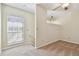 Upstairs loft area featuring carpet flooring and bright windows at 7200 Ulmerton Rd # B4, Largo, FL 33771