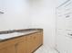 The laundry room has a sink, cabinets and door access at 7743 Bingham Ct, Tampa, FL 33625