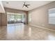 Spacious living room featuring tile flooring and sliding glass doors at 7743 Bingham Ct, Tampa, FL 33625