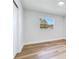 Bedroom featuring light floors, white walls, a window with backyard view and a closet at 303 Suzette Dr, Brandon, FL 33511
