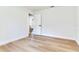 Clean bedroom with a modern door, light wood floors, and inviting space, ready for personal touches at 303 Suzette Dr, Brandon, FL 33511