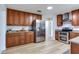 Kitchen features stainless steel appliances, wooden cabinetry, and granite countertops at 303 Suzette Dr, Brandon, FL 33511