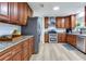 Spacious kitchen with stainless steel appliances, granite counters, and wooden cabinets at 303 Suzette Dr, Brandon, FL 33511