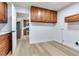 Spacious kitchen showcases stainless steel appliances and wooden cabinets at 303 Suzette Dr, Brandon, FL 33511