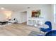 Open-concept living room with barstool seating and a cozy dining area nearby at 303 Suzette Dr, Brandon, FL 33511
