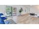 Sunlit living room with a view of the backyard, leading to screened in patio at 303 Suzette Dr, Brandon, FL 33511