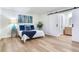 Bright bedroom featuring modern decor and sliding barn door at 303 Suzette Dr, Brandon, FL 33511