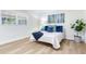Bright main bedroom featuring a cozy bed and neutral walls at 303 Suzette Dr, Brandon, FL 33511