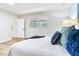 Light-filled bedroom featuring a large window and neutral walls at 303 Suzette Dr, Brandon, FL 33511