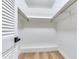 Spacious walk-in closet with built-in shelving and ample storage, providing organization and convenience at 303 Suzette Dr, Brandon, FL 33511