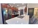 A kitchen with stainless steel appliances, a large island, and wood cabinets offers a modern cooking space at 10518 Lake Montauk Dr, Riverview, FL 33578