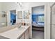 Bathroom vanity with a view into the bedroom at 11162 Kapok Grand Cir, Madeira Beach, FL 33708