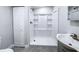 Updated bathroom with white shower, modern vanity and fixtures, and convenient closet at 11201 Blendale Dr, Riverview, FL 33569