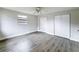 Bright bedroom features new floors, large windows, modern ceiling fan, and ample closet space at 11201 Blendale Dr, Riverview, FL 33569